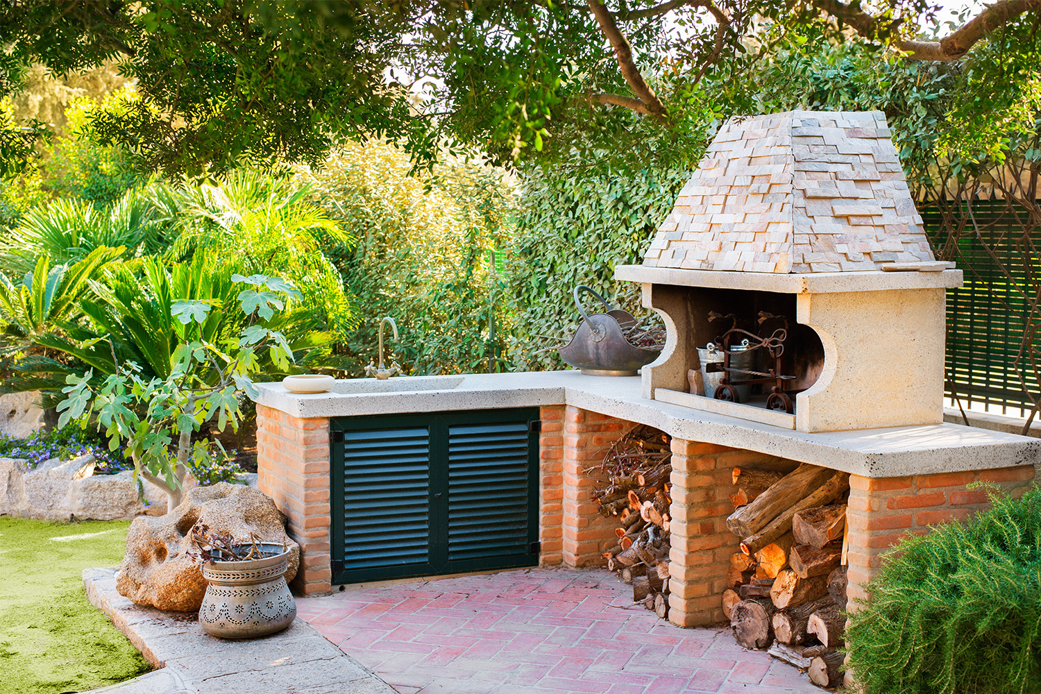 Outdoor kitchen with oven and sink