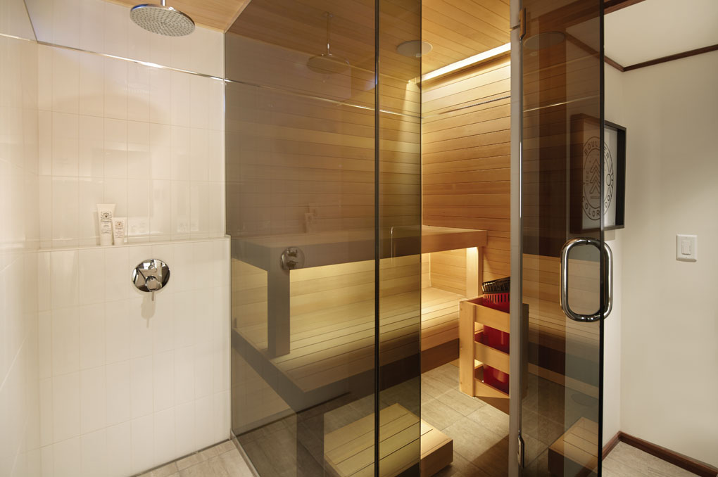 A remodeled bathroom shows a sauna next to the shower.
