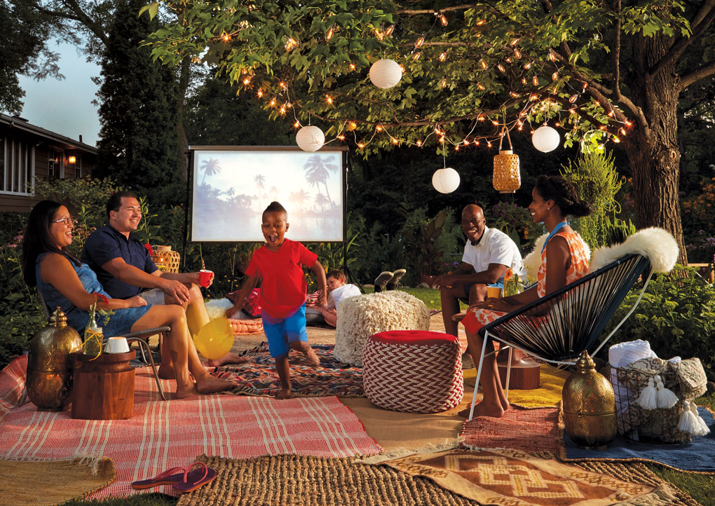 Friends and family gather for an outdoor movie night.