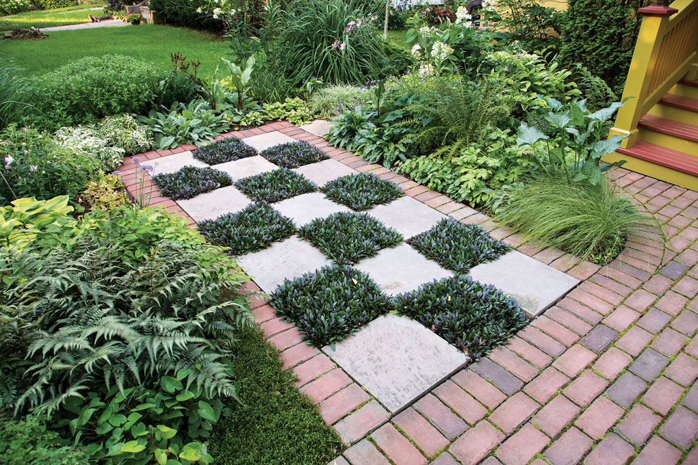 A checkered walkway using stone and ajuga "Chocolate Chip."