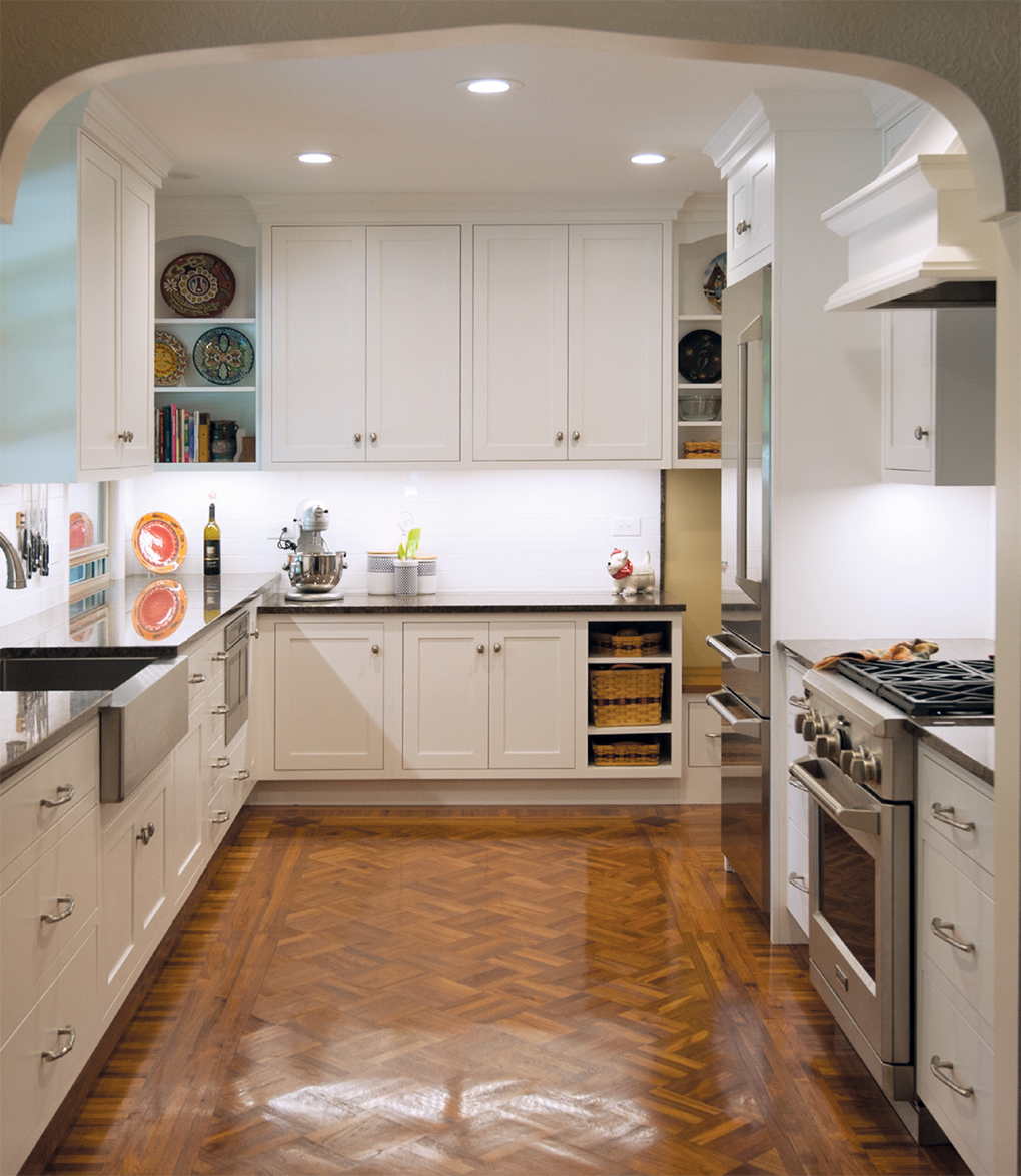 White kitchen with white cabinets and light brown floor
