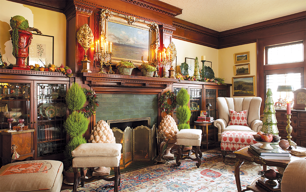 Christmasy front room with mini trees and festive chairs