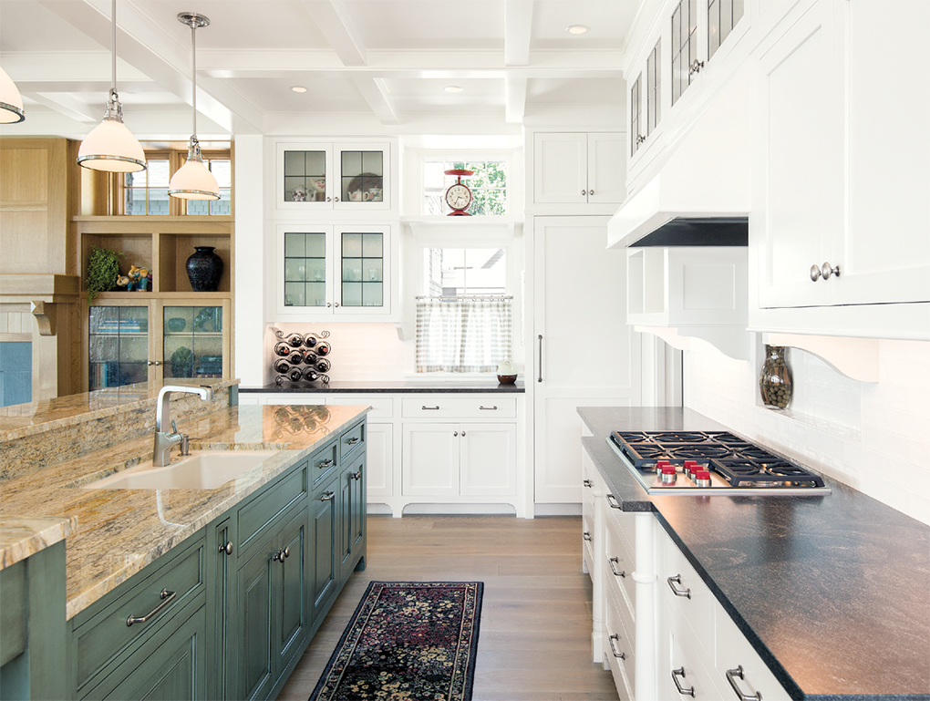 To avoid blocking the lake view, the kitchen holds only essential appliances camoflauged behind cabinetry. The rest are housed in the adjacent pantry.