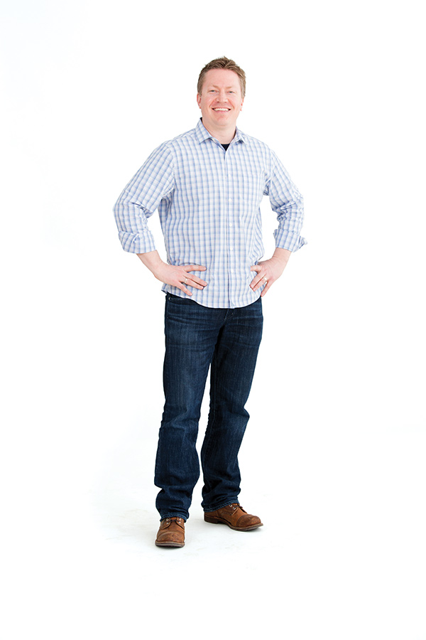 Photo of a man standing against a white background