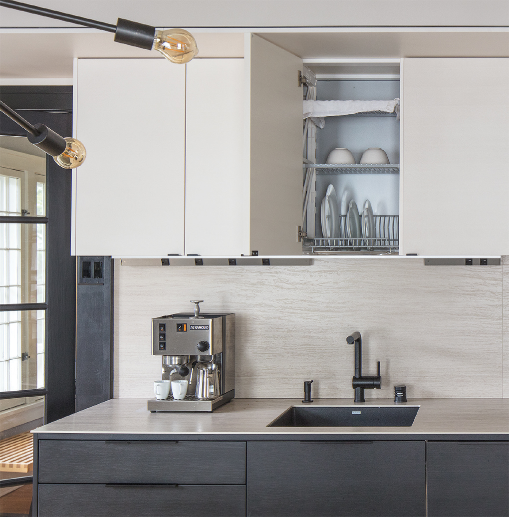 A drip tray above a sink is a clever way to store dishes while also drying them.