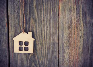 Small home charm on wood background