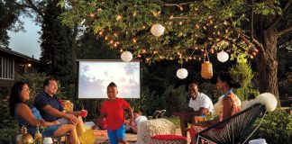 Friends and family gather for an outdoor movie night.