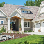 The exterior of a cottage-style home built by M & M Home Contractors.