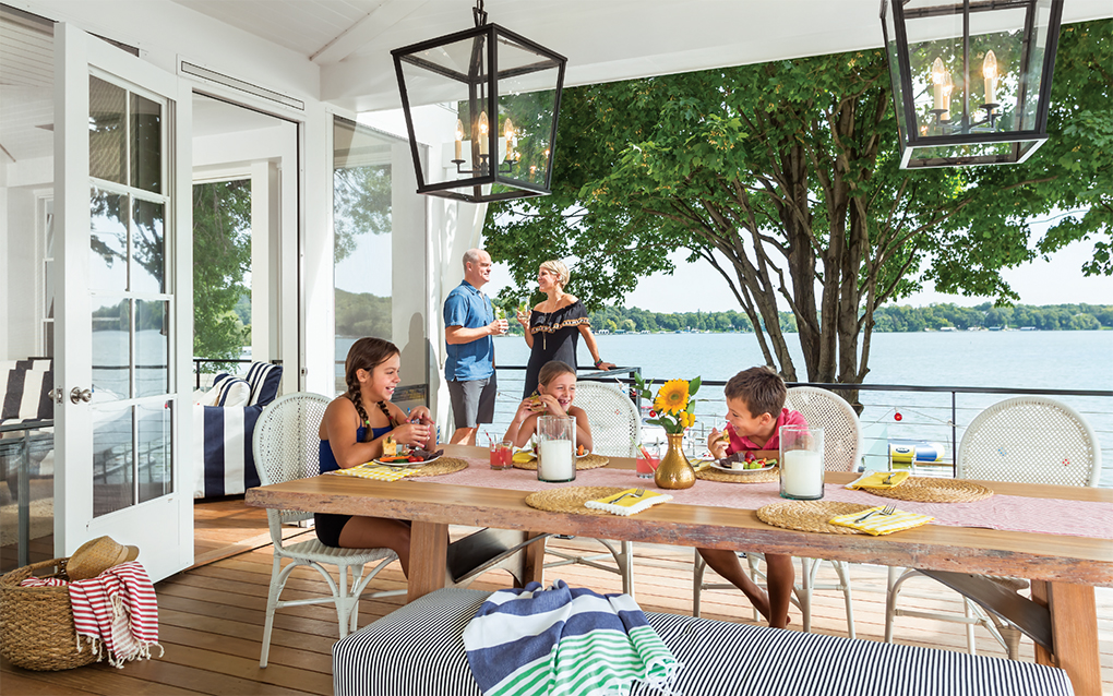 Erin and Charlie Zosel enjoy the deck, while the kids (left to right) Melissa Remick, 12, Sloane Zosel, 8, and Adam Remick, 10, grab a light lunch before heading back to the water.