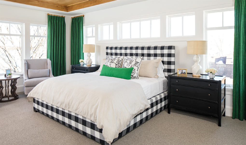 Windows overlooking Lake Minnetonka surround the master bedroom.