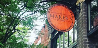 Ryan and Suzanne Huggett, owners of The Makers Studio, outside its storefront in Excelsior, Minnesota.