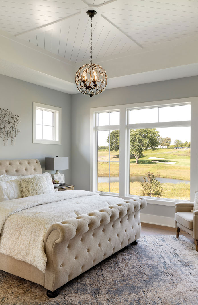 The master bedroom is a study in tranquility, with soft fabrics and muted colors. Part of Midwest Home's 2018 Luxury Home Tour.