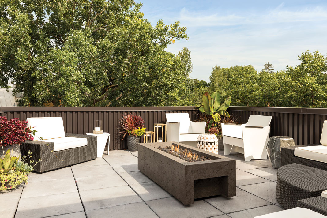 A rooftop’s patio features a bluestone terrace that provides an outdoor getaway, with a seating area, gas fireplace, and additional space for the owners to add a garden or hot tub. Part of Midwest Home's 2018 Luxury Home Tour.