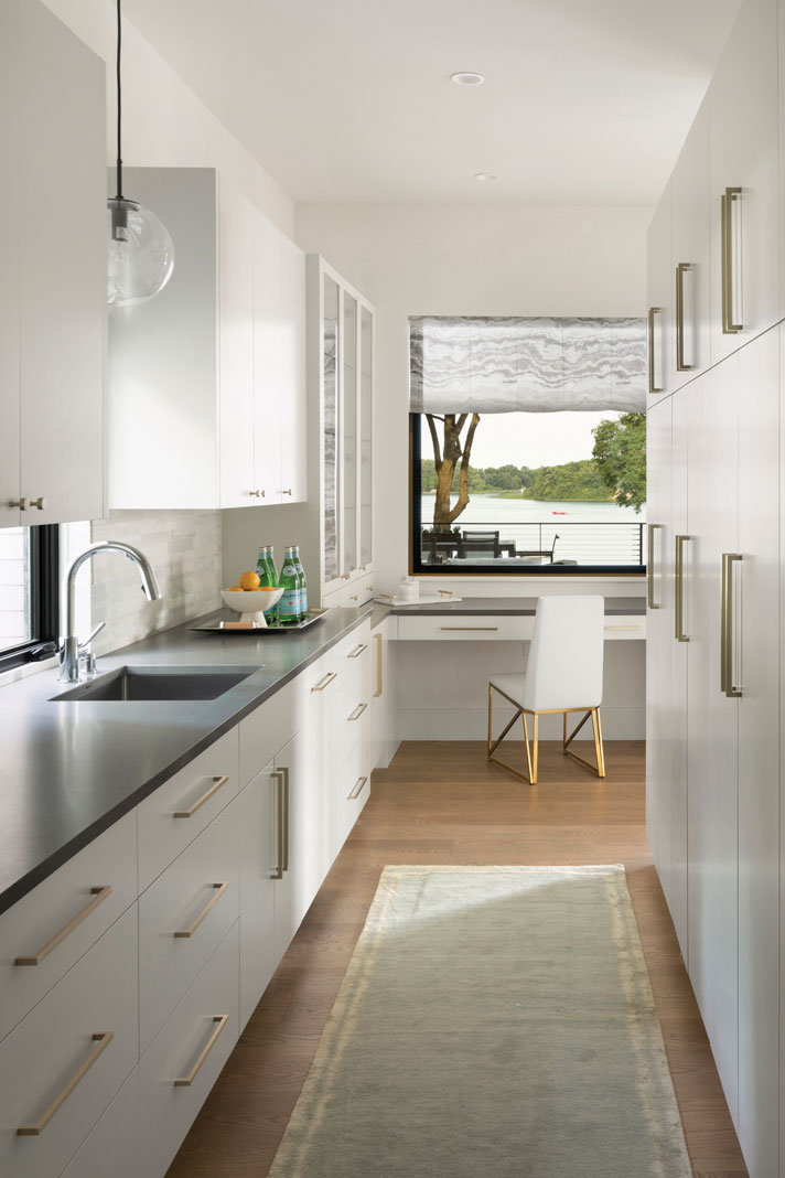 An open and airy pantry, tucked behind the kitchen, provides the perfect place for food prep. Part of Midwest Home's 2018 Luxury Home Tour.