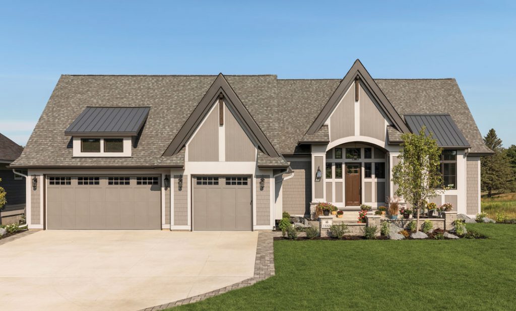 Situated on the edge of the scenic Royal Club championship golf course, the home features a three-car garage and a paver courtyard leading up to the front door. Part of Midwest Home's 2018 Luxury Home Tour.