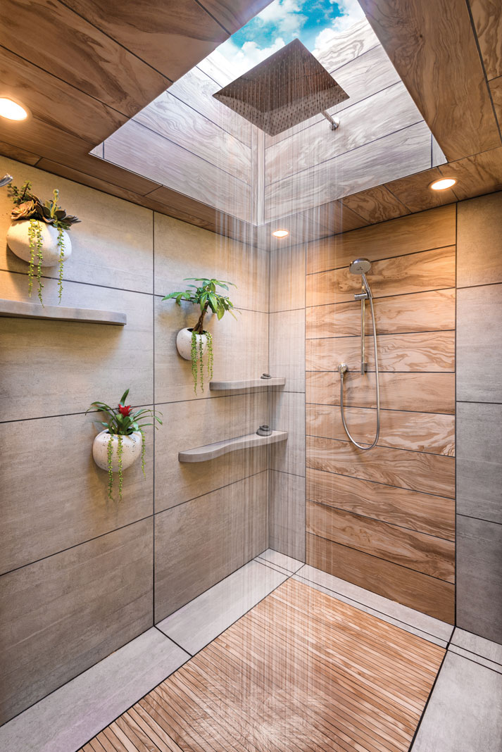 The bath’s new design reflects the client’s love of Asian style. Highlights are a soothing rain shower, faux-wood accent tiles, and tatami-mat-like flooring.