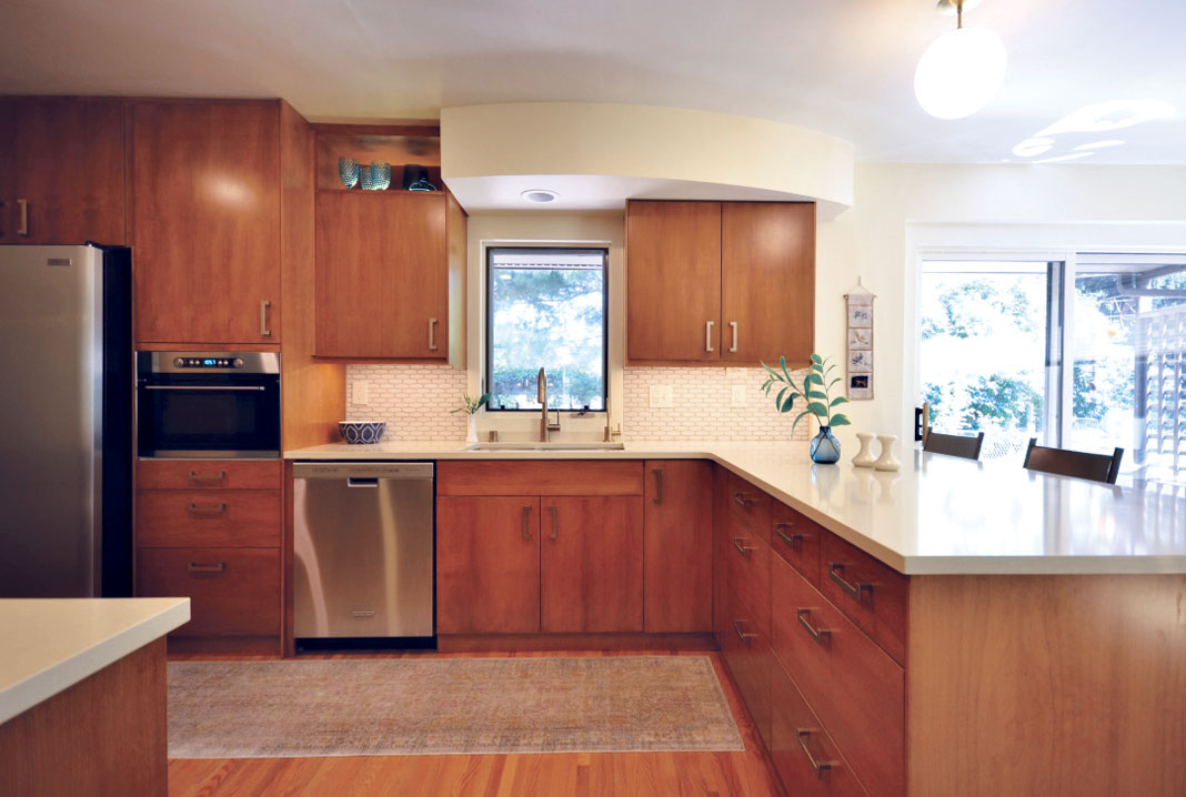 In this kitchen, the cream tones, combined with the warmth and texture of the natural wood, brought together an airy, light space with the mod mid-century look the client hoped for.