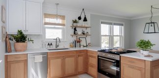 Image of a white kitchen with light wood