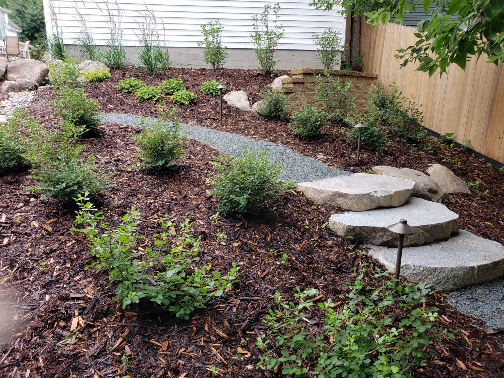 A courtyard landscaped by Trio Landscaping